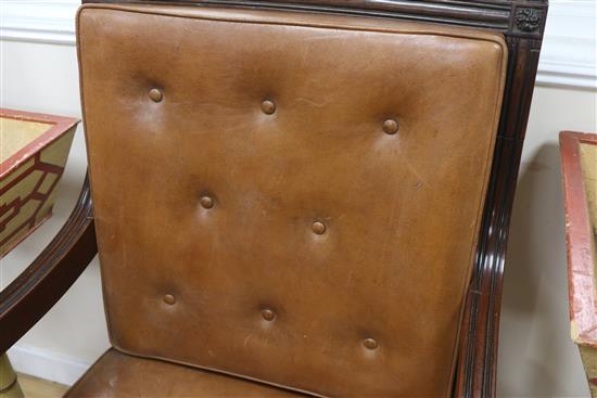 A leather button back bergere chair
